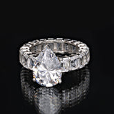 SooSilkyGems A FULL ETERNITY RING WITH A DROPLET SOLITAIRE