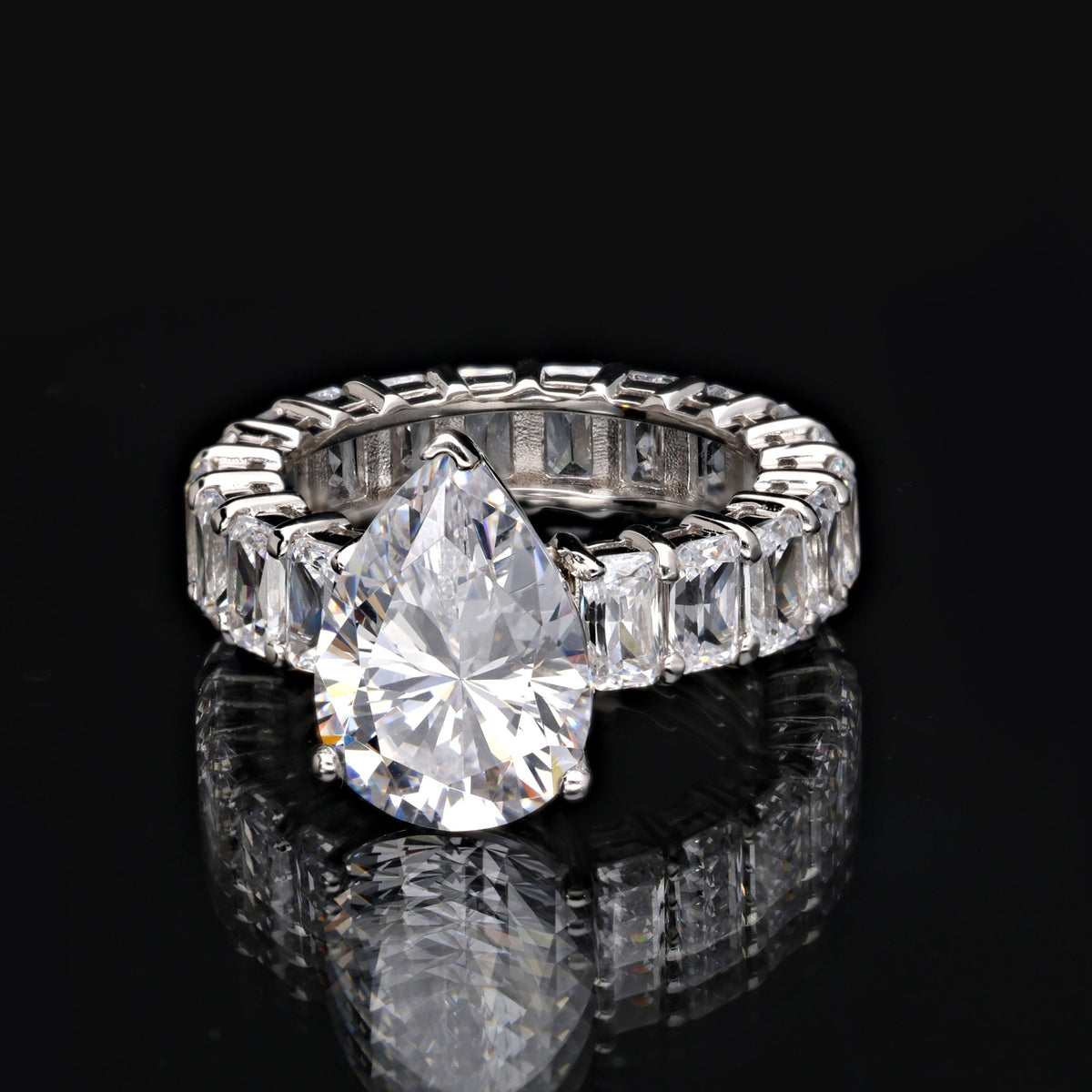 SooSilkyGems A FULL ETERNITY RING WITH A DROPLET SOLITAIRE